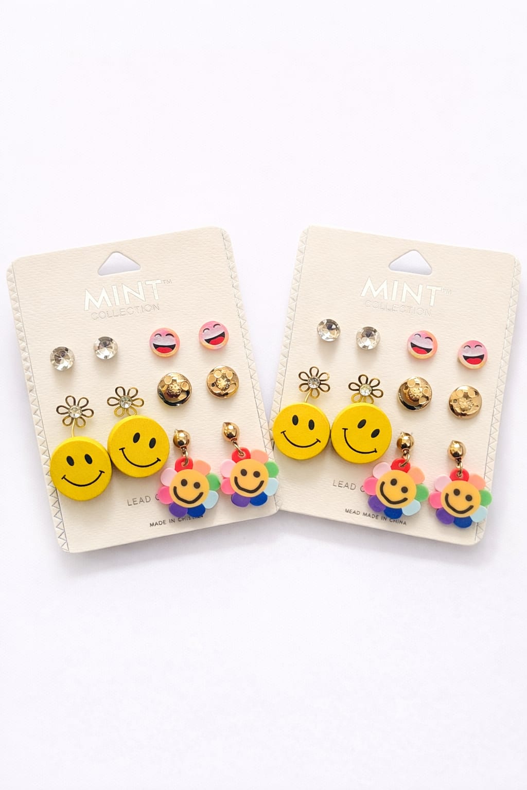 Conjunto de aretes con caras sonrientes