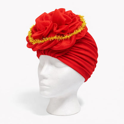 Turbante elegante con flor superior